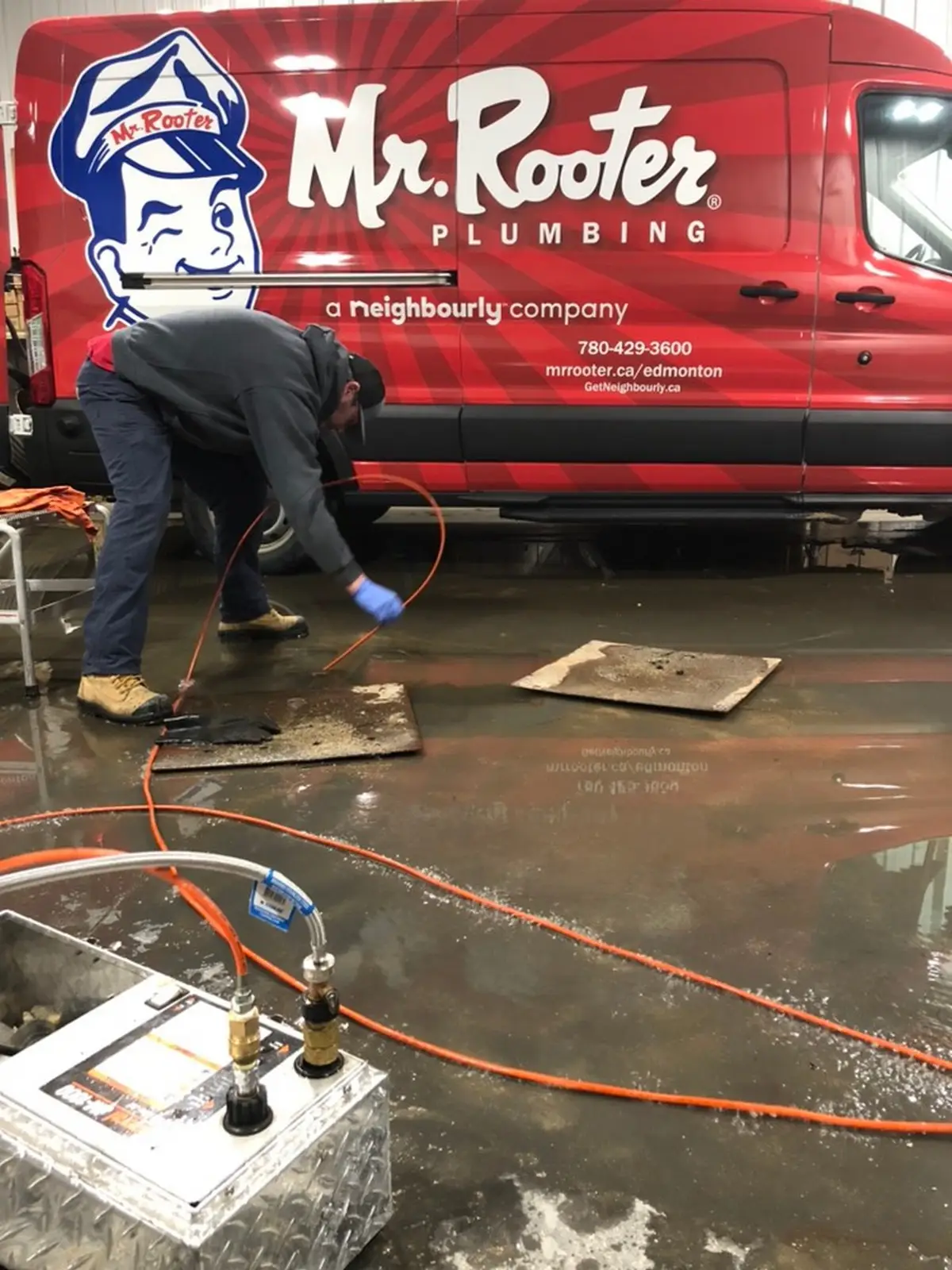 Mr. Rooter Plumbing technician clearing commercial drain in Edmonton