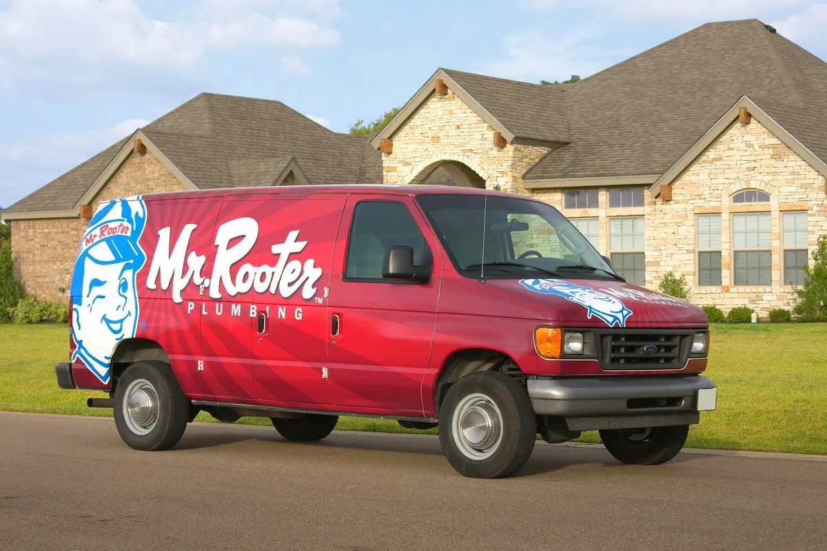 Mr. Rooter Plumbing van parked in front of Vancouver home