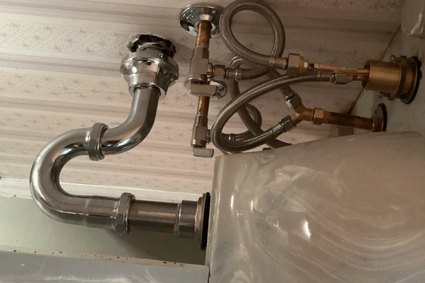 After image of repiping a sink for a bathroom faucet installation.