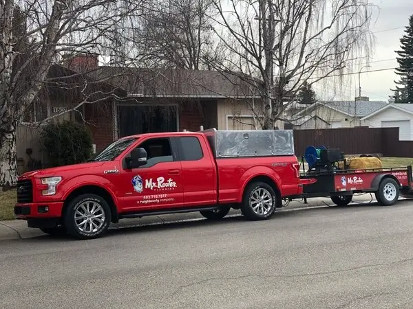 A truck with a trailer carrying specialized tools and equipment used for Lethbridgeemergency plumbing services.