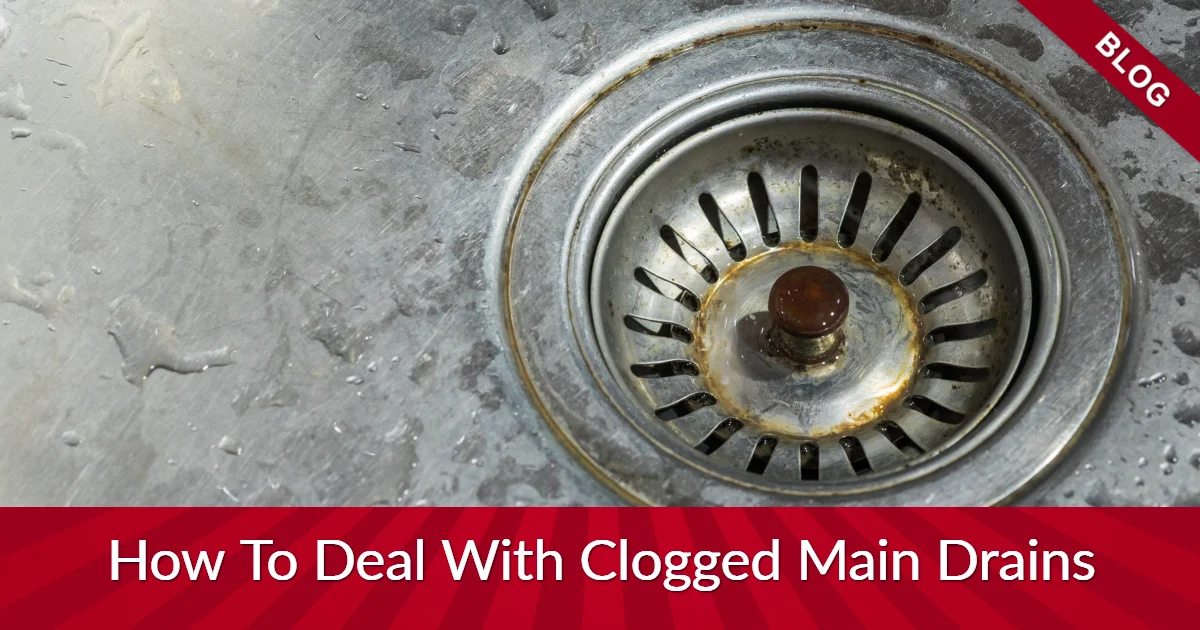 Drain in sink with banners reading "blog" and "How To Deal with Clogged Main Drains"