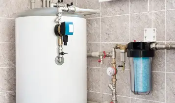 Whole-house water filtration system installed in a home.
