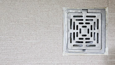 A residential floor drain that could benefit from Regina backwater valve installation.