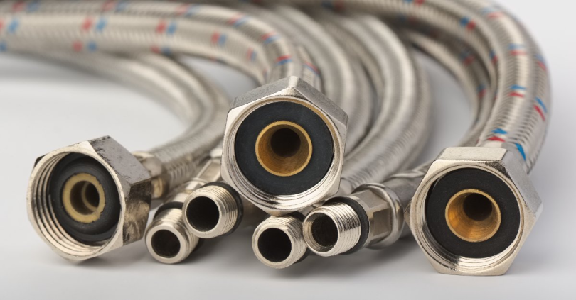 A collection of flexible, metal plumbing lines ready to be used for water line replacement in Calgary, AB.