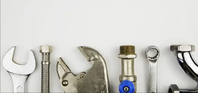Set of tools used by plumbers for garburator repair in Edmonton.