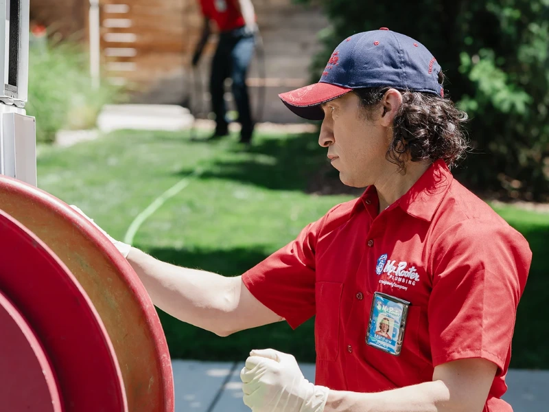 Mr. Rooter professional preparing to do a Hydroscrub Jetting service.