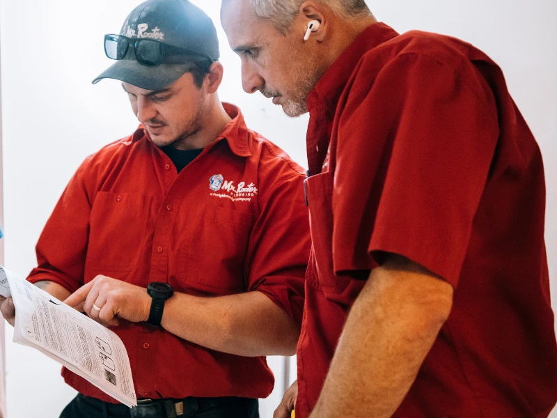 Two Mr. Rooter employees.