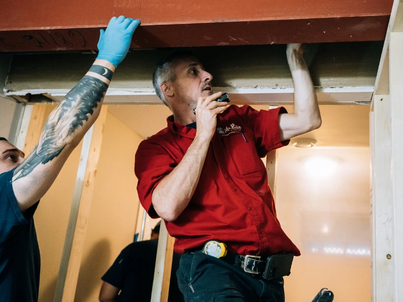 Mr. Rooter professionals fixing sewer line.