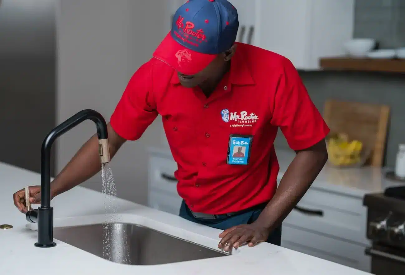 Mr. Rooter Plumber employee in Bradner fixing a clogged drain
