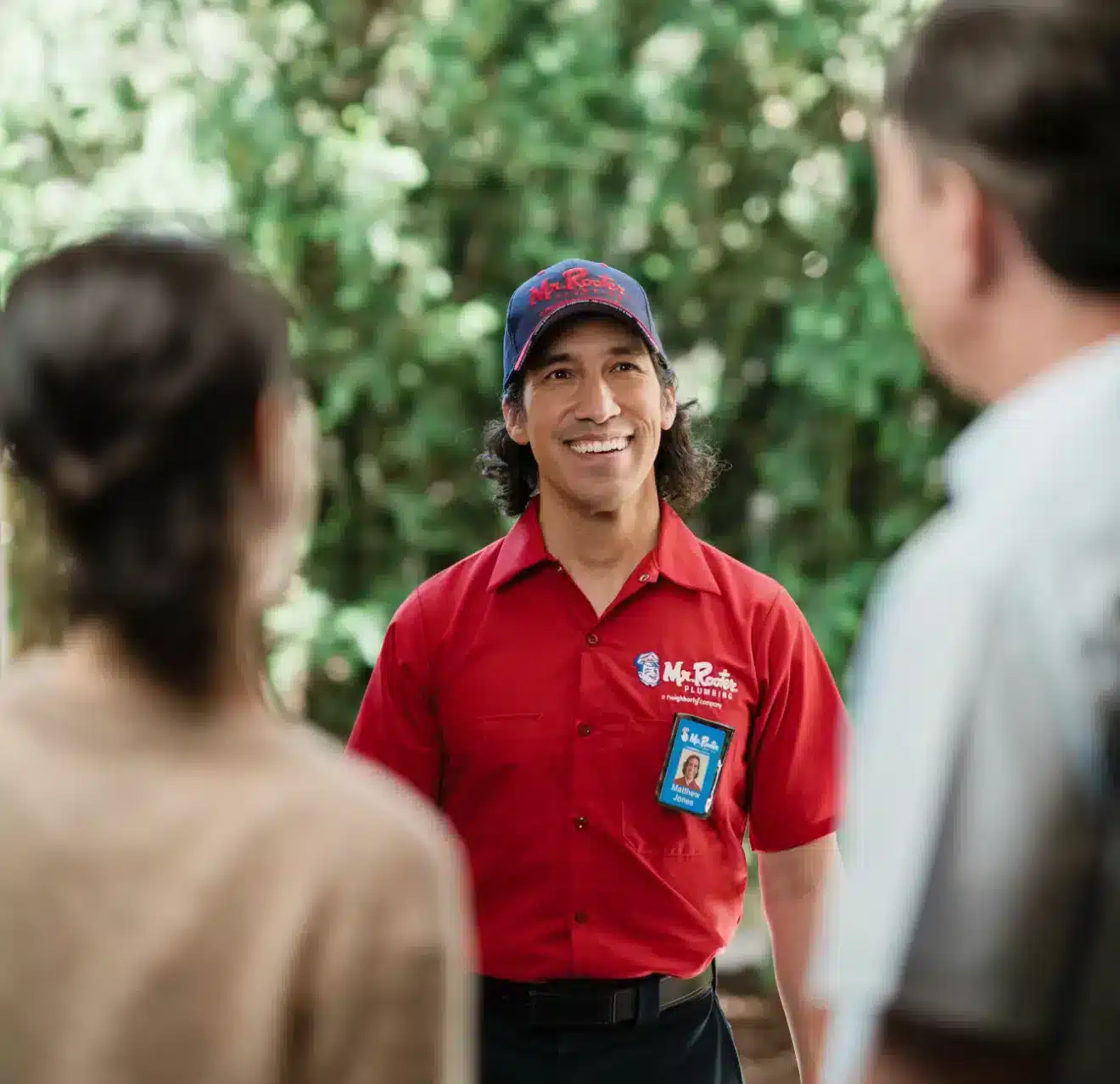 A Mr. Rooter Plumber employee greeting hownowners in Bradner
