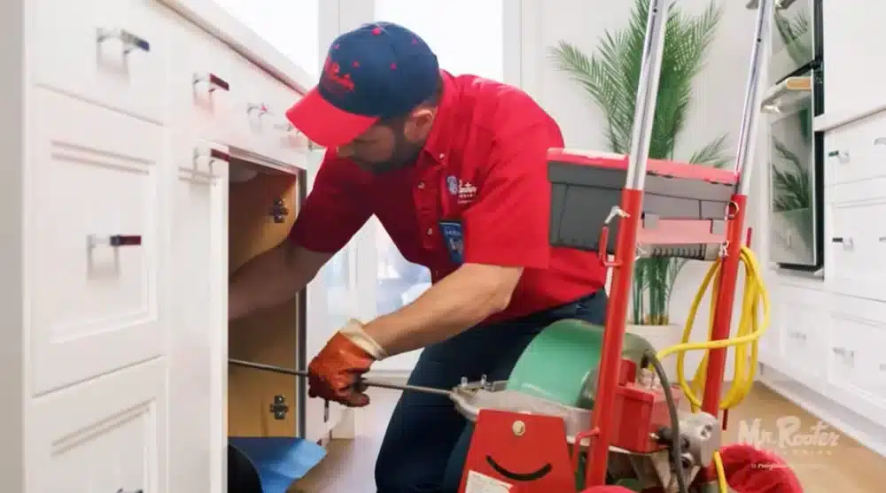 Mr. Rooter employee cleaning a drain in Tobiano, British Columbia