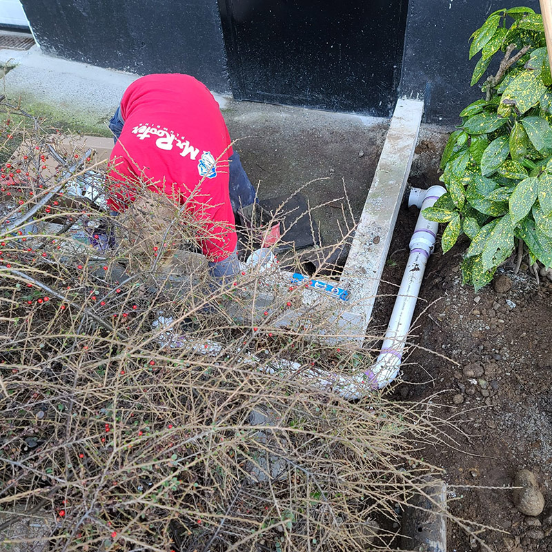 Mr. Rooter Plumber installing perimeter drain pipe in Abbotsford.