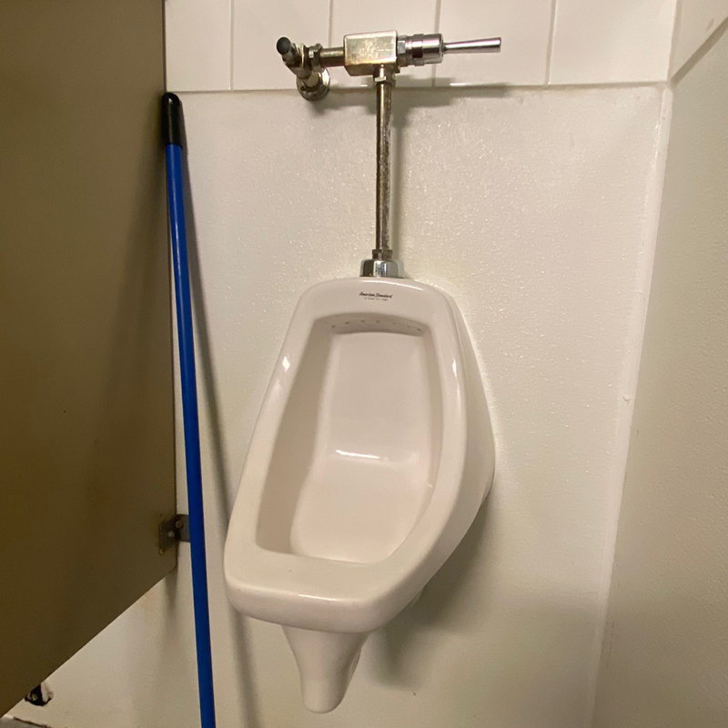 Public bathroom urinal in Abbotsford, repaired by Mr. Rooter Plumbing.